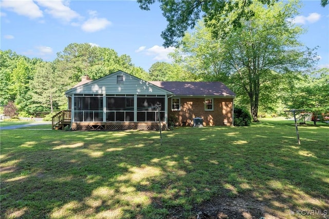5441 Claridge Dr, Chesterfield, VA 23832 - back of house with a sunroom, a yard, and a chimney