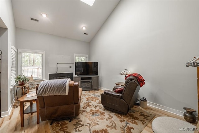 3909 Foxfield Ter, Henrico, VA 23233 - living area with light wood-style flooring, high vaulted ceiling, and baseboards