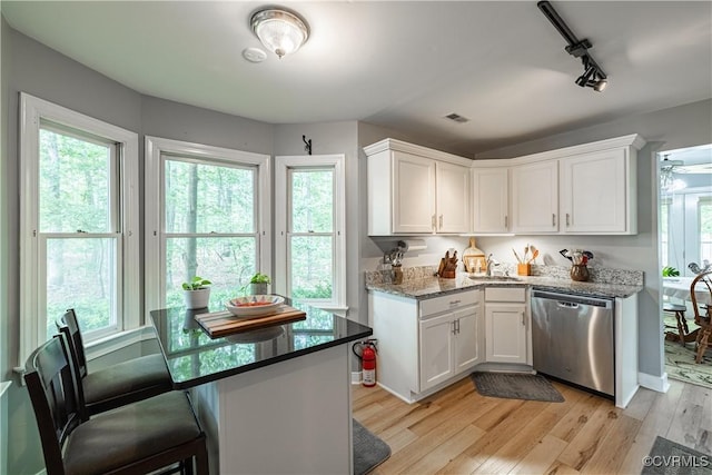 3909 Foxfield Ter, Henrico, VA 23233 - kitchen featuring stainless steel dishwasher, white cabinetry, light wood finished floors, track lighting, and a sink