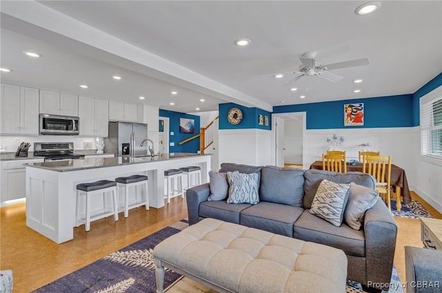 224 Oyster Creek Dr, White Stone, VA 22578 - living area featuring stairway, recessed lighting, wainscoting, ceiling fan, and light wood-style floors