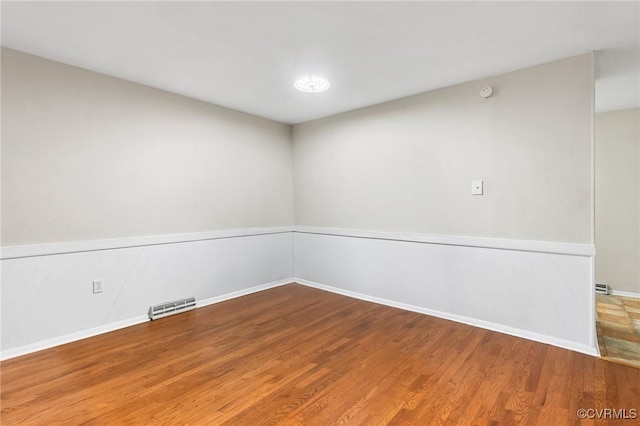 4 Little Brook Ln, Henrico, VA 23228 - empty room with wood finished floors, wainscoting, and baseboards
