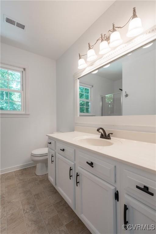 3206 Ramsey Dr, Chester, VA 23831 - bathroom featuring vanity, toilet, and an enclosed shower