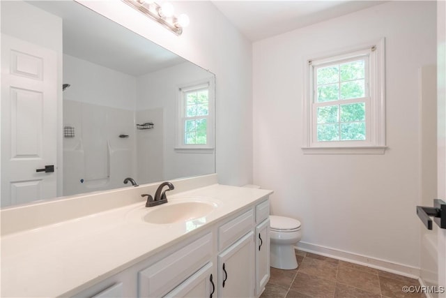 3206 Ramsey Dr, Chester, VA 23831 - bathroom featuring vanity, a shower, baseboards, and toilet