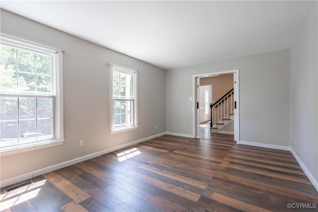 3206 Ramsey Dr, Chester, VA 23831 - spare room with dark wood-type flooring, baseboards, and stairs