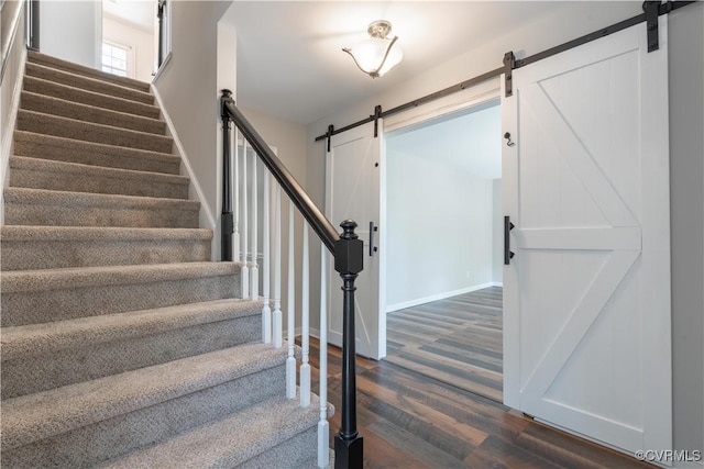 3206 Ramsey Dr, Chester, VA 23831 - staircase with a barn door, wood finished floors, and baseboards