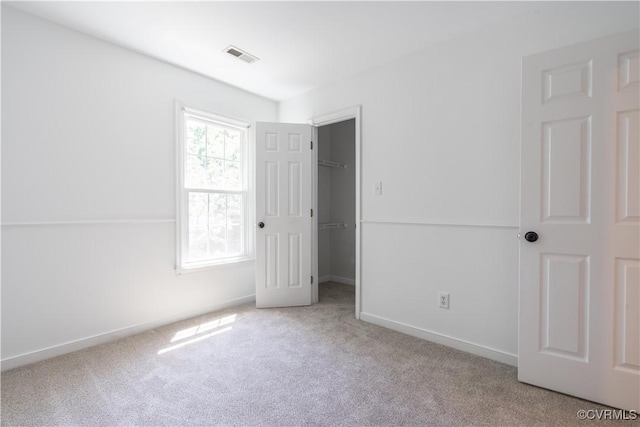 3206 Ramsey Dr, Chester, VA 23831 - unfurnished bedroom featuring carpet flooring, a walk in closet, baseboards, and a closet