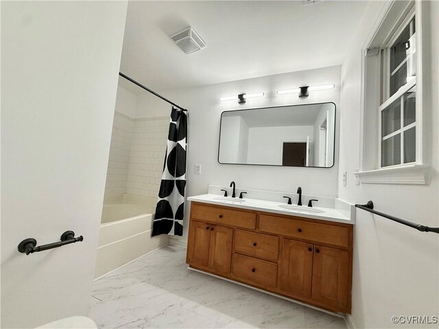 4608 Stoney Creek Pkwy, Chester, VA 23831 - bathroom featuring marble look tiles, double vanity, and shower / bathtub combination with curtain
