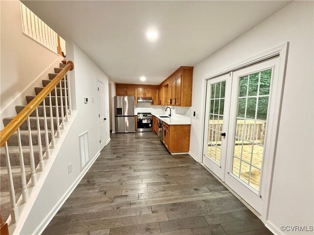 4608 Stoney Creek Pkwy, Chester, VA 23831 - kitchen with stainless steel appliances, brown cabinets, light countertops, dark wood-style flooring, and french doors