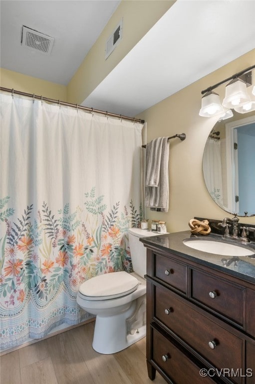 2615 Towngate Ct, Henrico, VA 23233 - bathroom with toilet, vanity, wood finished floors, and a shower with curtain