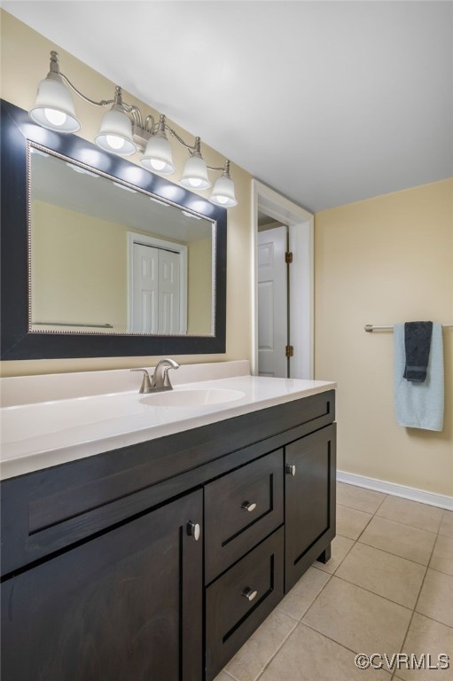 2615 Towngate Ct, Henrico, VA 23233 - bathroom featuring vanity, tile patterned flooring, and baseboards