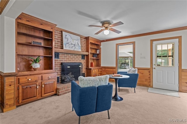 325 Hamlet Rd, Manakin Sabot, VA 23103 - living area with ceiling fan, light carpet, a wainscoted wall, crown molding, and a brick fireplace