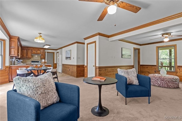 325 Hamlet Rd, Manakin Sabot, VA 23103 - living room with wainscoting, wooden walls, a ceiling fan, light colored carpet, and ornamental molding