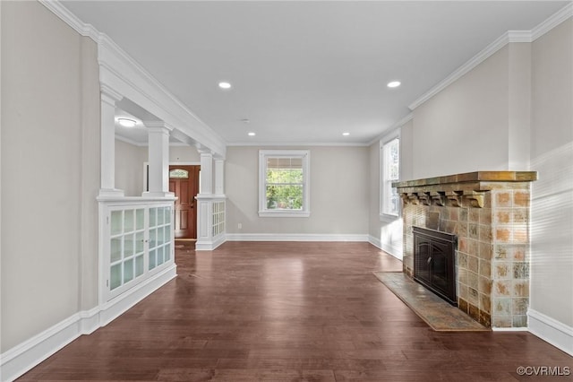 2920 Hawthorne Ave, Richmond, VA 23222 - unfurnished living room with a fireplace, hardwood / wood-style floors, baseboards, recessed lighting, and decorative columns