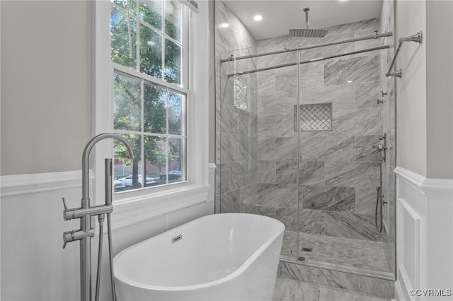 2920 Hawthorne Ave, Richmond, VA 23222 - full bathroom with a freestanding tub, a stall shower, marble look tiles, and recessed lighting