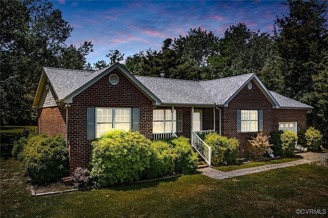 327 White Sand Dr, Heathsville, VA 22473 - ranch-style house with brick siding, a yard, and a shingled roof