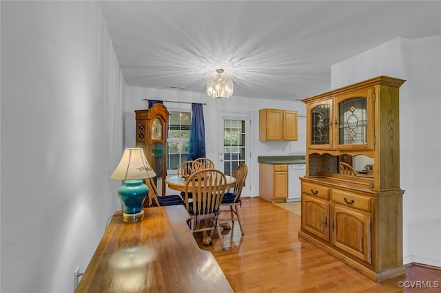 327 White Sand Dr, Heathsville, VA 22473 - dining space featuring a chandelier and light wood-type flooring