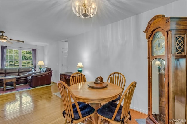 327 White Sand Dr, Heathsville, VA 22473 - dining room with light wood-style flooring, ceiling fan, and a chandelier