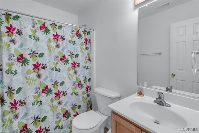 327 White Sand Dr, Heathsville, VA 22473 - bathroom featuring vanity, toilet, and curtained shower