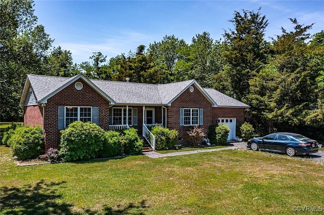 327 White Sand Dr, Heathsville, VA 22473 - ranch-style house featuring a garage, brick siding, a front yard, and a shingled roof