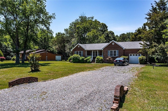 327 White Sand Dr, Heathsville, VA 22473 - single story home with gravel driveway, an attached garage, a front lawn, and view of scattered trees