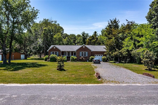 327 White Sand Dr, Heathsville, VA 22473 - ranch-style home with driveway, a garage, and a front lawn