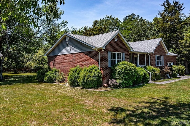 327 White Sand Dr, Heathsville, VA 22473 - view of side of home featuring brick siding, a yard, and roof with shingles