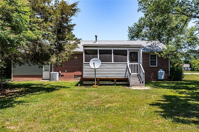 327 White Sand Dr, Heathsville, VA 22473 - back of property with a lawn, cooling unit, a sunroom, and brick siding