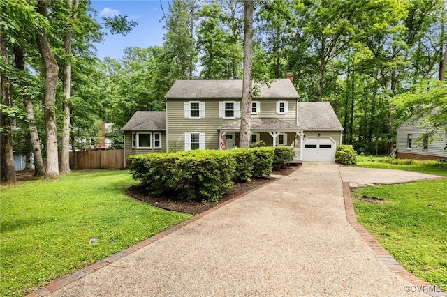 3119 Quail Hill Dr, Midlothian, VA 23112 - view of front of home featuring concrete driveway, an attached garage, a chimney, and view of scattered trees
