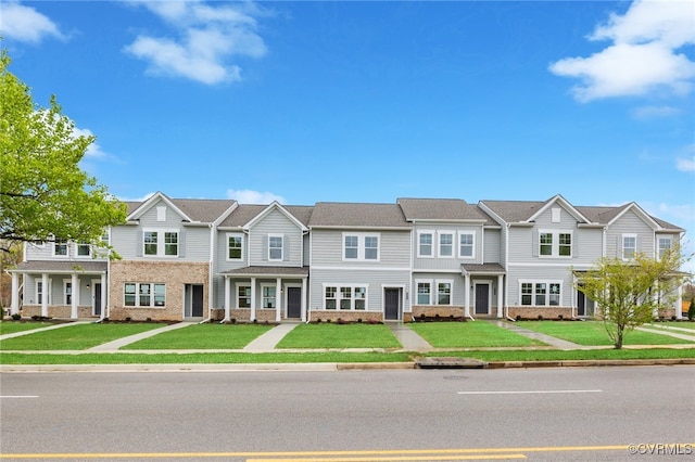 3405 Pond Aly, Richmond, VA 23234 - townhome / multi-family property with brick siding and a front yard