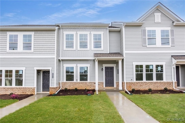 3413 Pond Aly, Richmond, VA 23234 - townhome / multi-family property with a front yard and brick siding