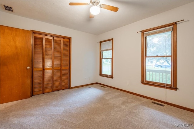 13100 Spring Trace Pl, Midlothian, VA 23112 - unfurnished bedroom featuring carpet, a closet, and a ceiling fan