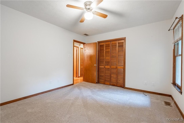 13100 Spring Trace Pl, Midlothian, VA 23112 - unfurnished bedroom with a closet, light carpet, and a ceiling fan