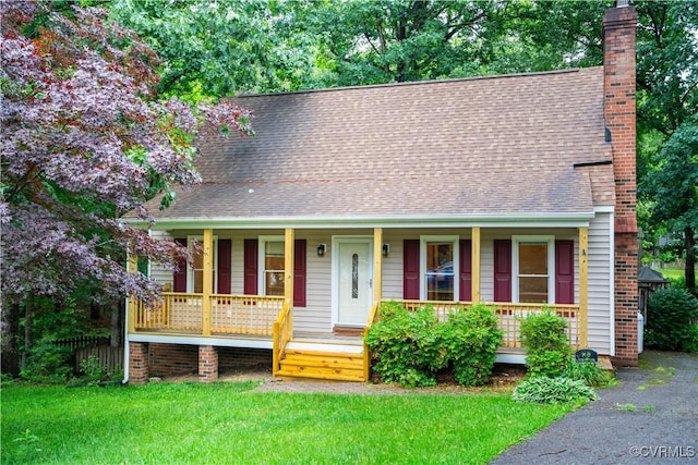 13100 Spring Trace Pl, Midlothian, VA 23112 - view of front of property with covered porch, a chimney, a shingled roof, and a front yard