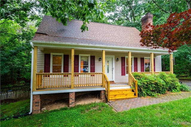 13100 Spring Trace Pl, Midlothian, VA 23112 - view of front facade with covered porch, a chimney, and a shingled roof