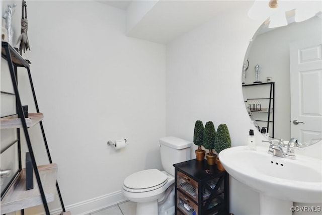 17912 Pine Canyon Trl, Moseley, VA 23120 - bathroom with toilet, tile patterned flooring, baseboards, and a sink