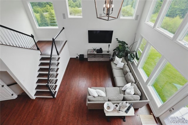 17912 Pine Canyon Trl, Moseley, VA 23120 - living room with a high ceiling, a chandelier, wood finished floors, baseboards, and stairway