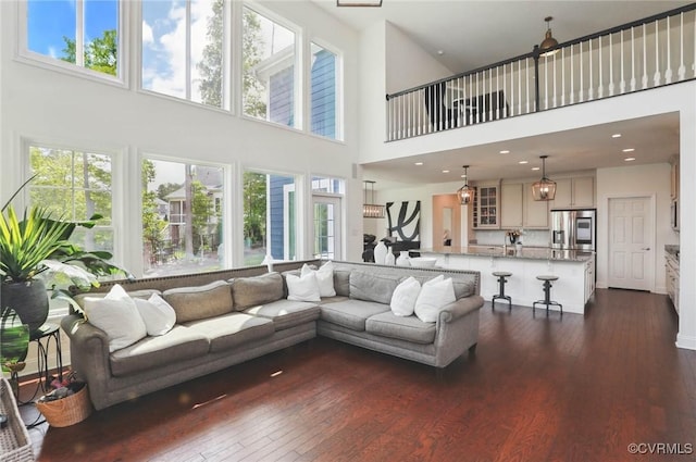 17912 Pine Canyon Trl, Moseley, VA 23120 - living room with dark wood-type flooring, a towering ceiling, and recessed lighting