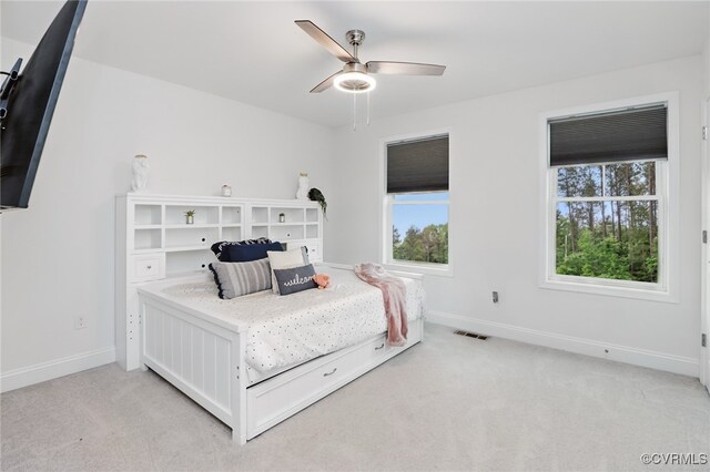 17912 Pine Canyon Trl, Moseley, VA 23120 - bedroom with light carpet, multiple windows, baseboards, and a ceiling fan