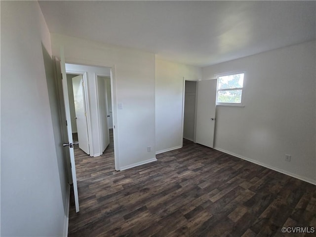4811 Altair Rd, Henrico, VA 23231 - unfurnished bedroom featuring dark wood-style floors, baseboards, and a closet