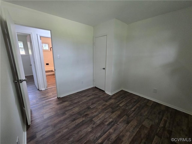 4811 Altair Rd, Henrico, VA 23231 - unfurnished bedroom featuring dark wood finished floors and baseboards