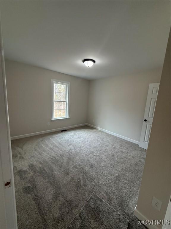 008 Barefords Mill Rd, Dunnsville, VA 22454 - carpeted empty room featuring baseboards