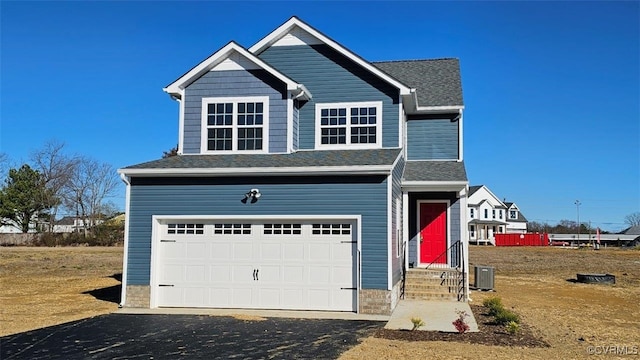 2628 Butterbean Ct, Richmond, VA 23231 - view of front facade with driveway, central AC, an attached garage, and entry steps