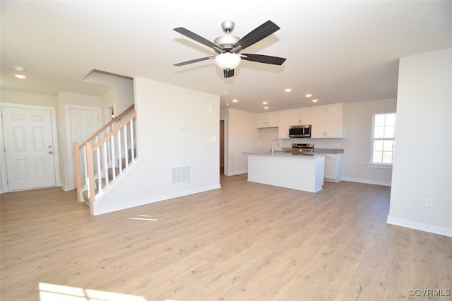 2628 Butterbean Ct, Richmond, VA 23231 - unfurnished living room with a sink, baseboards, light wood-style floors, recessed lighting, and ceiling fan