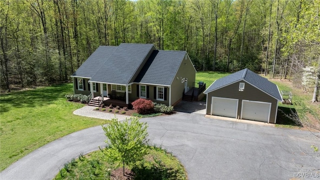 20031 Woodland Fox Ln, Rockville, VA 23146 - view of front of house with a porch, an outdoor structure, a wooded view, a garage, and driveway
