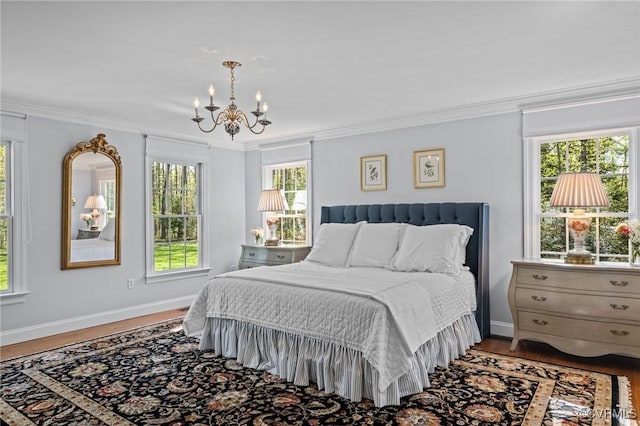 20031 Woodland Fox Ln, Rockville, VA 23146 - bedroom featuring a chandelier, multiple windows, crown molding, baseboards, and wood finished floors