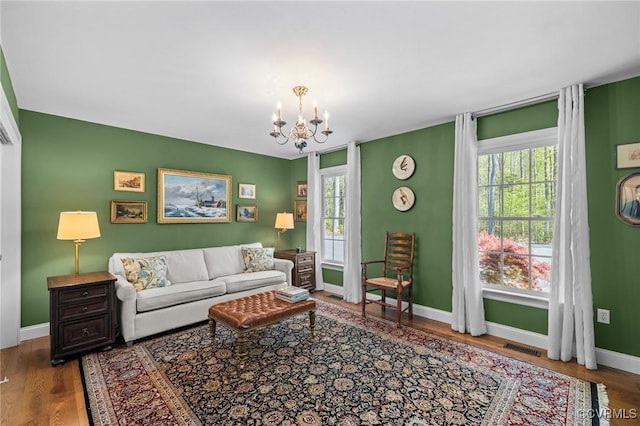 20031 Woodland Fox Ln, Rockville, VA 23146 - living room featuring a chandelier, plenty of natural light, and wood finished floors