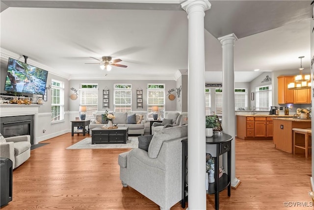 8412 Newbys Mill Dr, Chesterfield, VA 23832 - living area with a ceiling fan, ornate columns, light wood finished floors, crown molding, and a fireplace with flush hearth