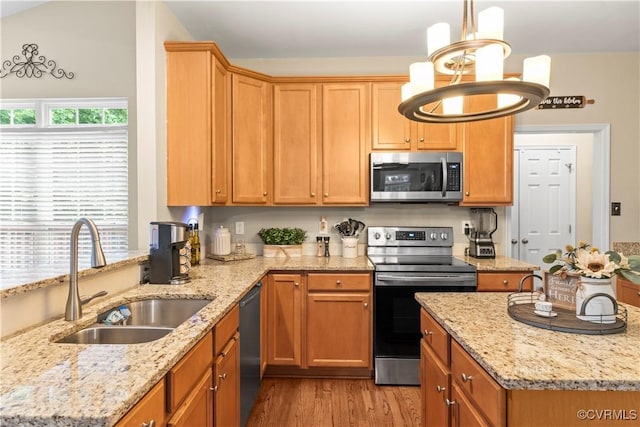 8412 Newbys Mill Dr, Chesterfield, VA 23832 - kitchen featuring stainless steel appliances, light wood-style flooring, light stone counters, and decorative light fixtures