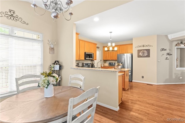 8412 Newbys Mill Dr, Chesterfield, VA 23832 - dining area featuring a chandelier and light wood finished floors