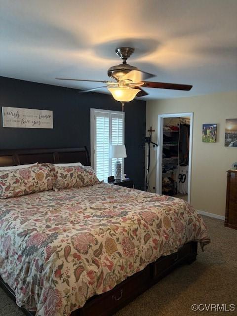 11292 Silverstone Dr, Mechanicsville, VA 23116 - bedroom with carpet floors, a ceiling fan, a spacious closet, and baseboards